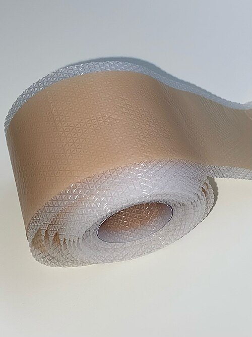 Rolled beige silicone gel sheet with textured surface