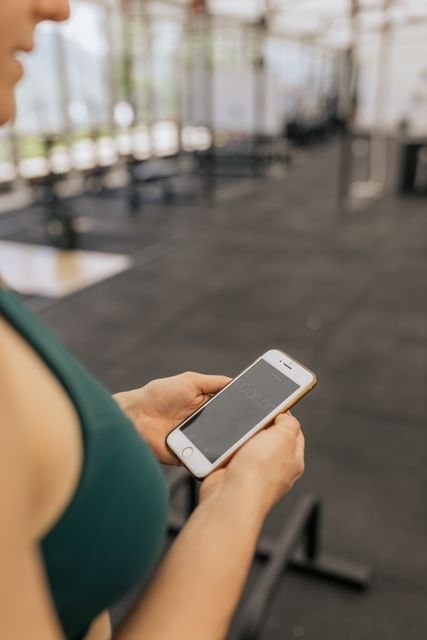 Woman holding a smartphone with a timer displayed